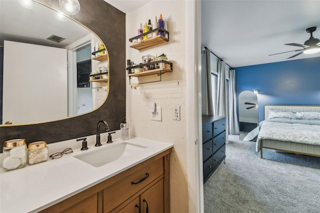 4114 Pinelake Ln Unit 202, Tampa, FL 33618 - bathroom with vanity, ceiling fan, and ensuite bath