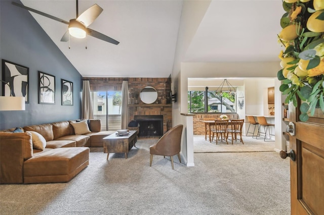 4114 Pinelake Ln Unit 202, Tampa, FL 33618 - carpeted living area with a brick fireplace, ceiling fan, and high vaulted ceiling