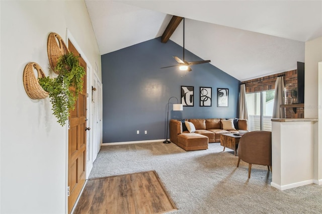 4114 Pinelake Ln Unit 202, Tampa, FL 33618 - living room with carpet flooring, beamed ceiling, a ceiling fan, and high vaulted ceiling