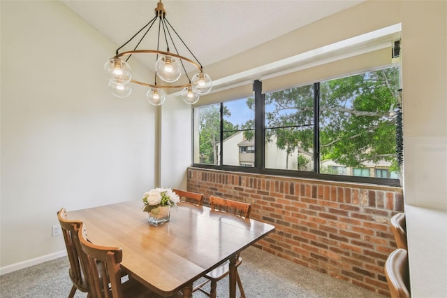 4114 Pinelake Ln Unit 202, Tampa, FL 33618 - carpeted dining space with a chandelier and baseboards
