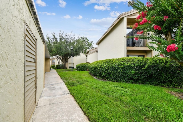 4114 Pinelake Ln Unit 202, Tampa, FL 33618 - view of grassy yard with a balcony