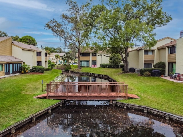 4114 Pinelake Ln Unit 202, Tampa, FL 33618 - view of property's community with a residential view, a wooden deck, and a lawn
