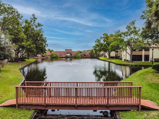 4114 Pinelake Ln Unit 202, Tampa, FL 33618 - exterior space featuring a deck with water view and a lawn
