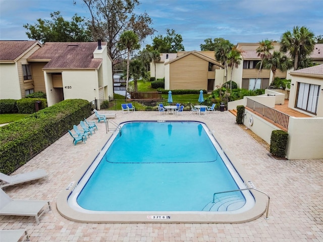 4114 Pinelake Ln Unit 202, Tampa, FL 33618 - community pool featuring a residential view and a patio area