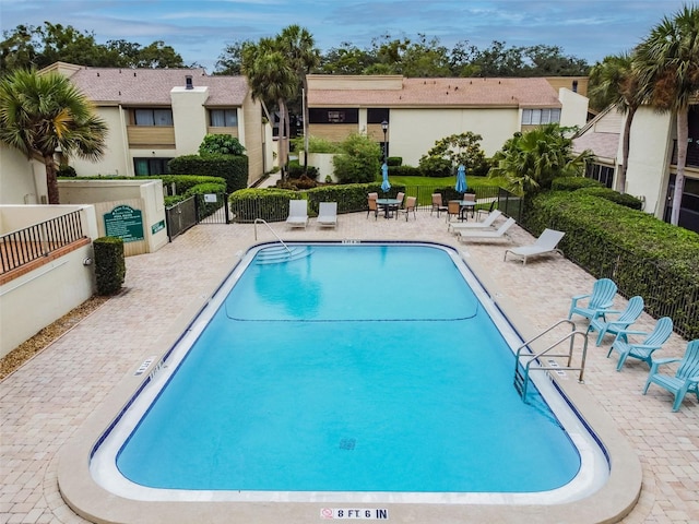 4114 Pinelake Ln Unit 202, Tampa, FL 33618 - community pool featuring a patio area