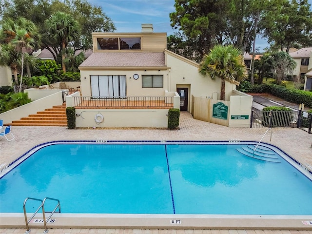 4114 Pinelake Ln Unit 202, Tampa, FL 33618 - community pool with stairs and a patio