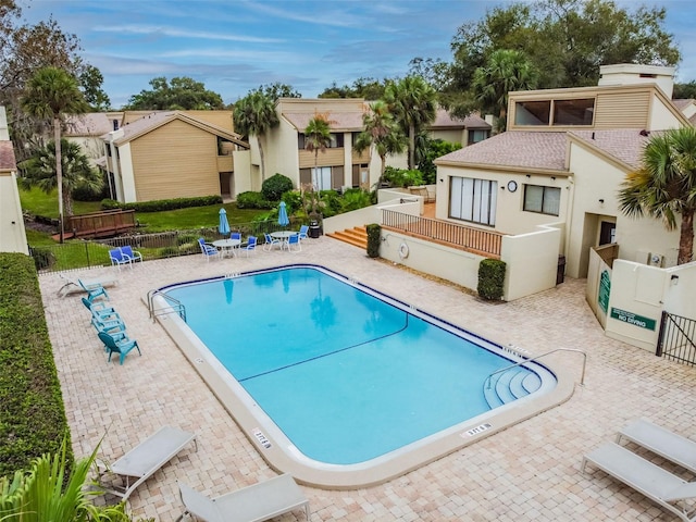 4114 Pinelake Ln Unit 202, Tampa, FL 33618 - community pool with a patio area and a residential view