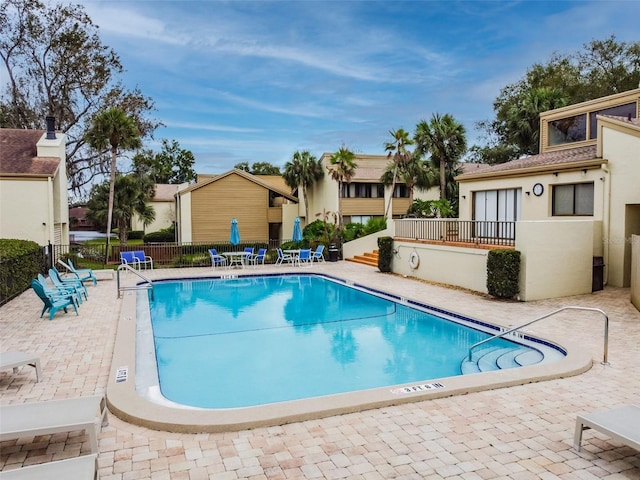 4114 Pinelake Ln Unit 202, Tampa, FL 33618 - community pool featuring a patio