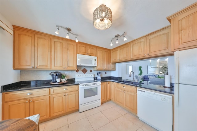 1591 Gulf Blvd Unit 304S, Clearwater Beach, FL 33767 - kitchen featuring white appliances, light tile patterned floors, light brown cabinetry, and a chandelier