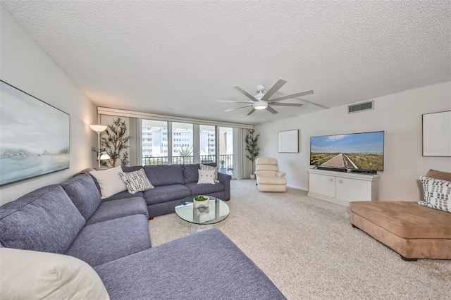 1591 Gulf Blvd Unit 304S, Clearwater Beach, FL 33767 - carpeted living room featuring ceiling fan and a textured ceiling