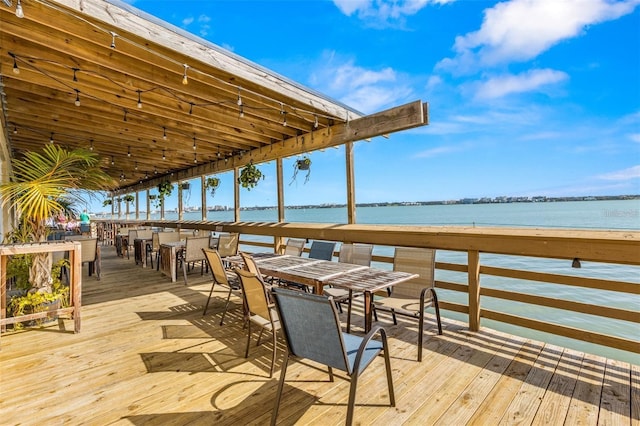 1591 Gulf Blvd Unit 304S, Clearwater Beach, FL 33767 - wooden terrace featuring a water view and outdoor dining area