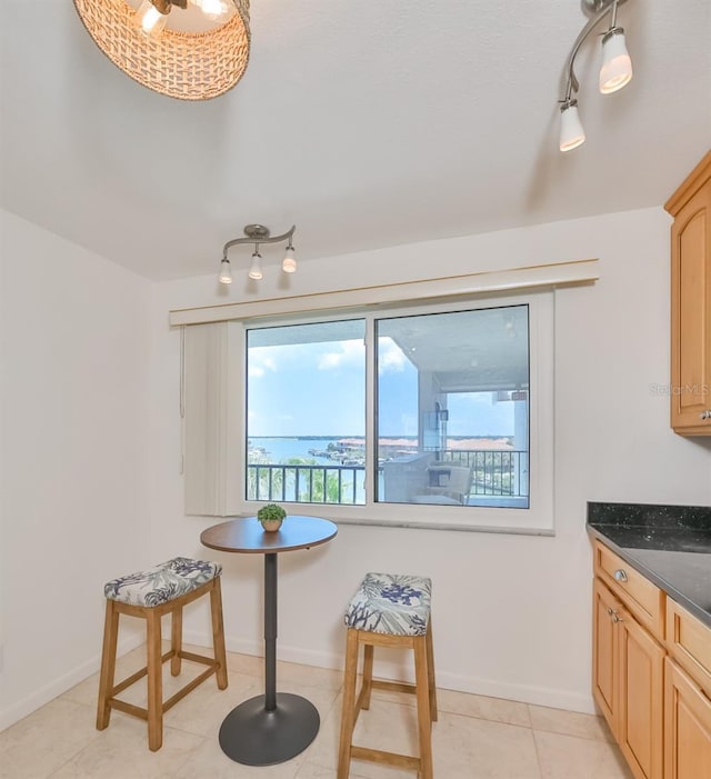 1591 Gulf Blvd Unit 304S, Clearwater Beach, FL 33767 - dining room with healthy amount of natural light and light tile patterned flooring