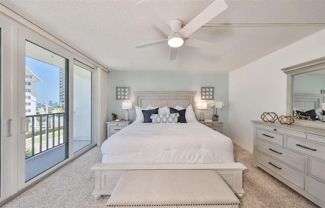 1591 Gulf Blvd Unit 304S, Clearwater Beach, FL 33767 - bedroom with light colored carpet, access to exterior, multiple windows, and a textured ceiling