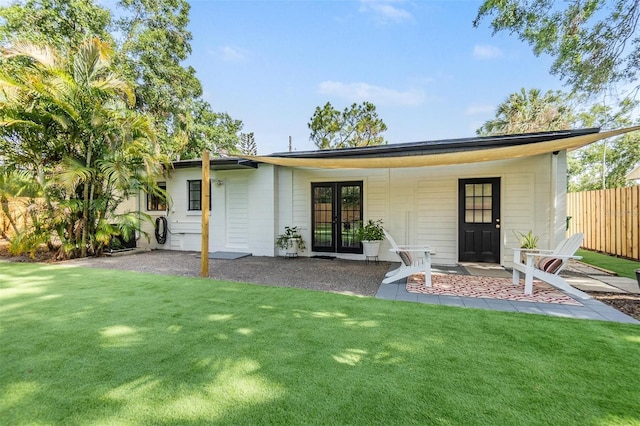 201 W Alva St, Tampa, FL 33603 - rear view of property with french doors and a patio