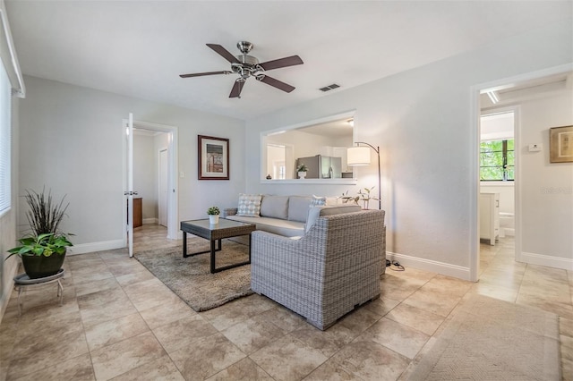 201 W Alva St, Tampa, FL 33603 - living room featuring ceiling fan and light tile patterned floors