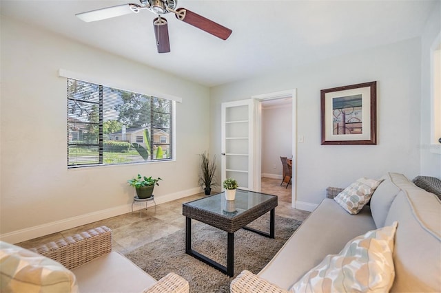 201 W Alva St, Tampa, FL 33603 - tiled living room featuring a ceiling fan and baseboards