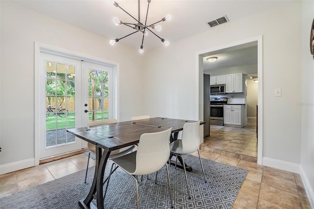 201 W Alva St, Tampa, FL 33603 - dining area featuring a chandelier, french doors, and light tile patterned floors