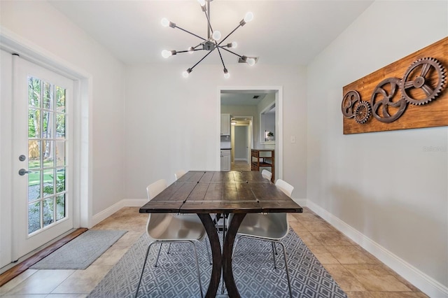 201 W Alva St, Tampa, FL 33603 - dining area with a chandelier and light tile patterned floors
