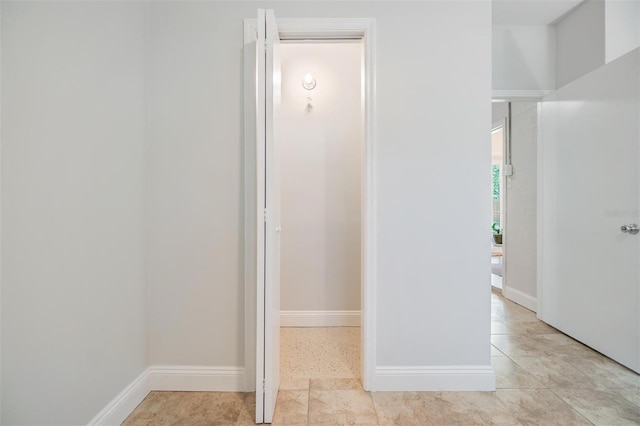201 W Alva St, Tampa, FL 33603 - hallway with baseboards and light tile patterned floors
