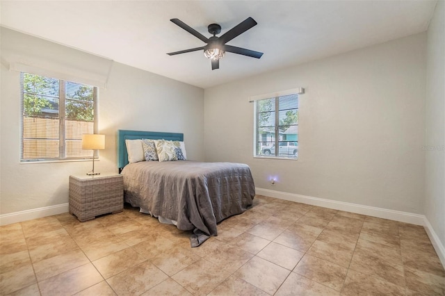 201 W Alva St, Tampa, FL 33603 - bedroom with a ceiling fan and light tile patterned floors