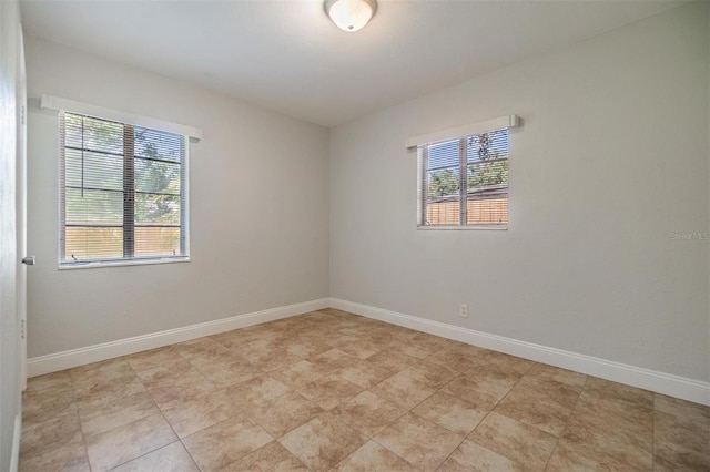 201 W Alva St, Tampa, FL 33603 - spare room featuring baseboards