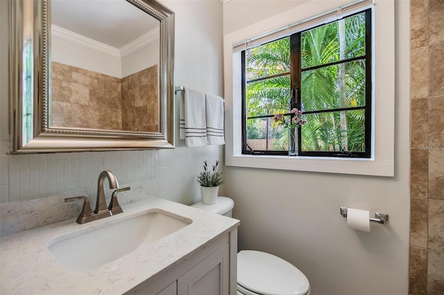 201 W Alva St, Tampa, FL 33603 - bathroom featuring crown molding, backsplash, and vanity