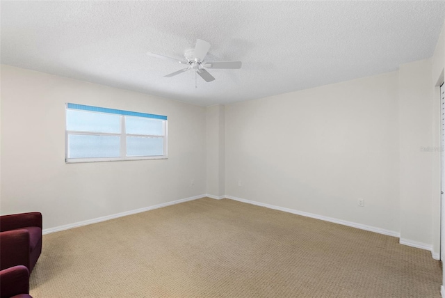 700 Beach Dr NE Unit 606, Saint Petersburg, FL 33701 - empty room featuring carpet, ceiling fan, and a textured ceiling