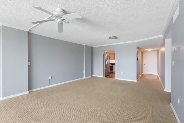 700 Beach Dr NE Unit 606, Saint Petersburg, FL 33701 - unfurnished room featuring ceiling fan, light carpet, a textured ceiling, and ornamental molding