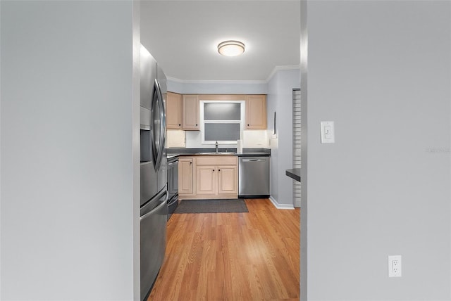 700 Beach Dr NE Unit 606, Saint Petersburg, FL 33701 - kitchen featuring stainless steel appliances, ornamental molding, light wood-style floors, dark countertops, and light brown cabinets