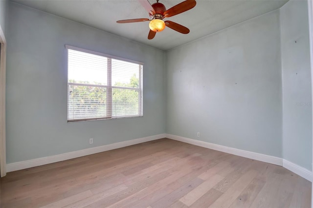 2228 Hannah Way S, Dunedin, FL 34698 - empty room with light wood-style floors and a ceiling fan