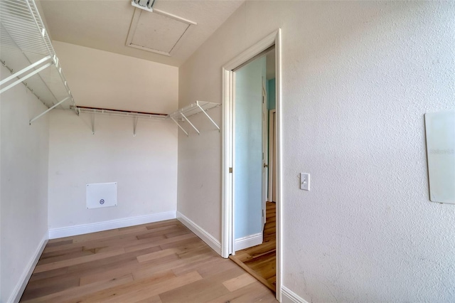 2228 Hannah Way S, Dunedin, FL 34698 - walk in closet featuring light wood finished floors