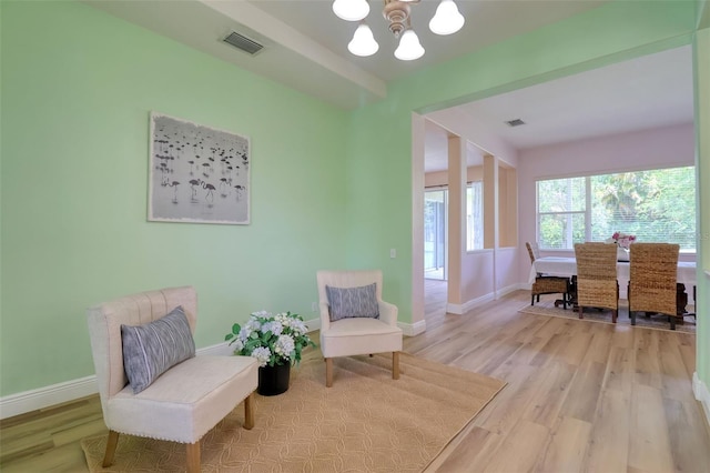 2228 Hannah Way S, Dunedin, FL 34698 - living area with a chandelier and light wood finished floors