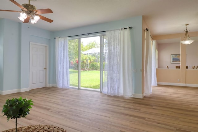 2228 Hannah Way S, Dunedin, FL 34698 - spare room featuring light wood finished floors and a ceiling fan