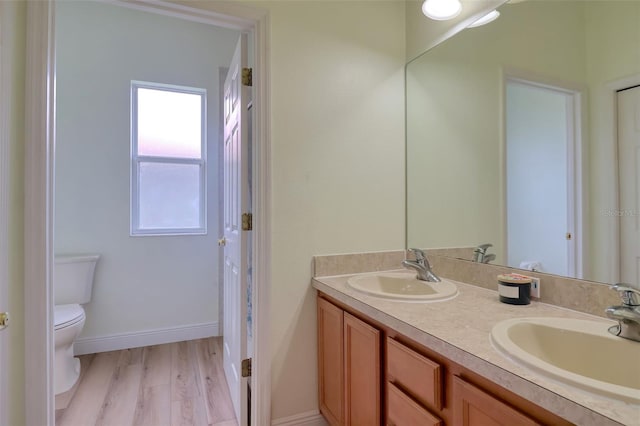 2228 Hannah Way S, Dunedin, FL 34698 - full bath with double vanity and wood finished floors