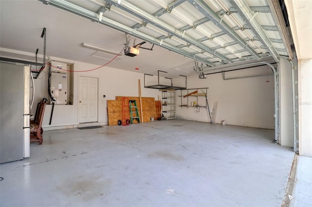 2228 Hannah Way S, Dunedin, FL 34698 - garage with a garage door opener and heating unit