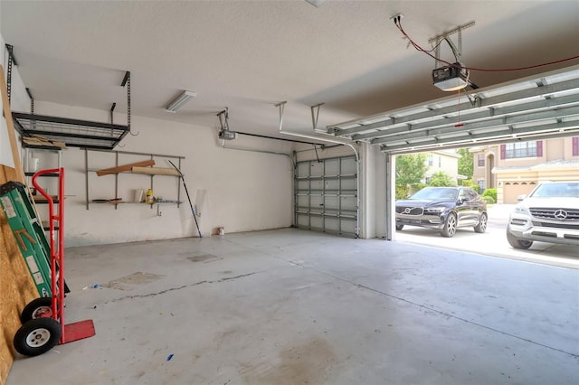 2228 Hannah Way S, Dunedin, FL 34698 - garage featuring a garage door opener