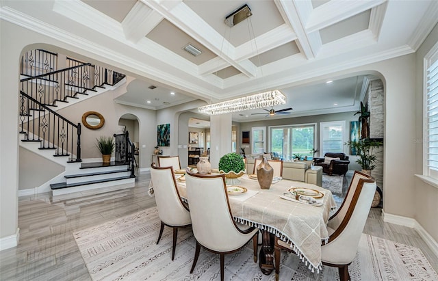 29038 Picana Ln, Wesley Chapel, FL 33543 - dining room with arched walkways, stairway, coffered ceiling, crown molding, and beamed ceiling