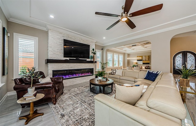 29038 Picana Ln, Wesley Chapel, FL 33543 - living area featuring a ceiling fan, crown molding, a stone fireplace, wood finished floors, and recessed lighting