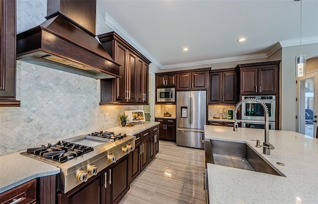 29038 Picana Ln, Wesley Chapel, FL 33543 - kitchen with stainless steel appliances, custom exhaust hood, pendant lighting, dark brown cabinets, and tasteful backsplash