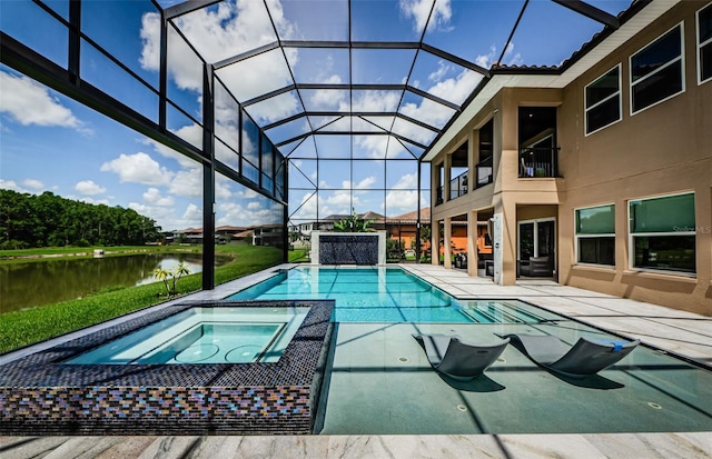 29038 Picana Ln, Wesley Chapel, FL 33543 - view of swimming pool featuring a patio area, a water view, a lanai, and a pool with connected hot tub