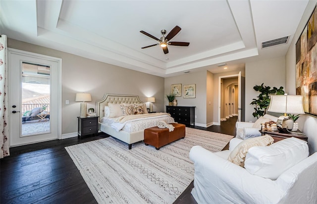 29038 Picana Ln, Wesley Chapel, FL 33543 - bedroom with a raised ceiling, access to exterior, dark wood-style floors, and ceiling fan