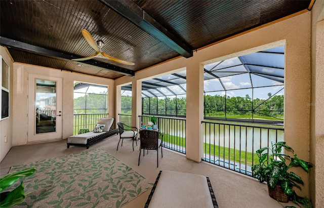 29038 Picana Ln, Wesley Chapel, FL 33543 - sunroom with a water view, ceiling fan, and beamed ceiling