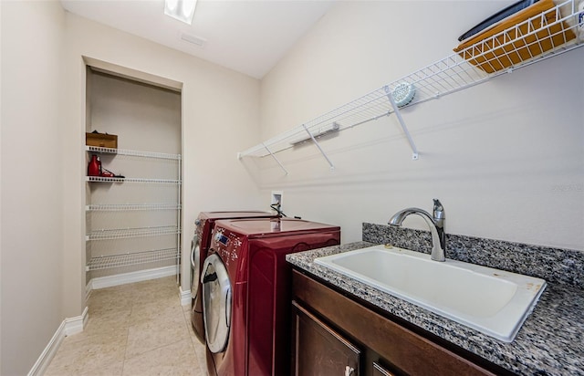 29038 Picana Ln, Wesley Chapel, FL 33543 - laundry room featuring washing machine and dryer and light tile patterned floors