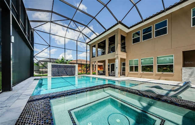 29038 Picana Ln, Wesley Chapel, FL 33543 - view of swimming pool featuring a patio area, a pool with connected hot tub, and a lanai