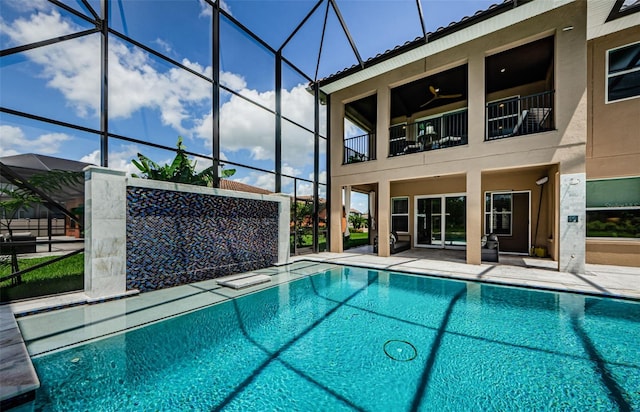 29038 Picana Ln, Wesley Chapel, FL 33543 - outdoor pool featuring a patio area and glass enclosure
