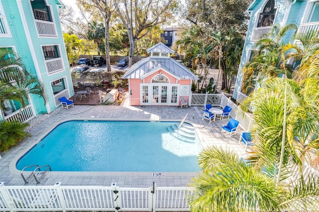 3002 W Cleveland St Unit B9, Tampa, FL 33609 - community pool with a patio, an outbuilding, and an exterior structure