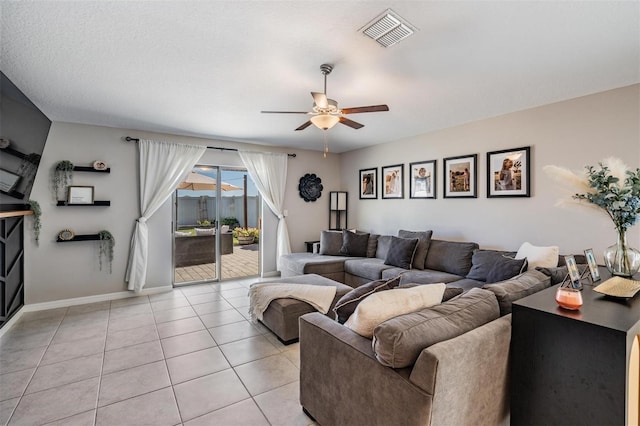 9839 Lemon Drop Loop, Sun City Center, FL 33573 - living room with ceiling fan and light tile patterned floors