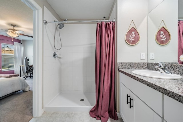 9839 Lemon Drop Loop, Sun City Center, FL 33573 - bathroom featuring connected bathroom, ceiling fan, vanity, and tiled shower