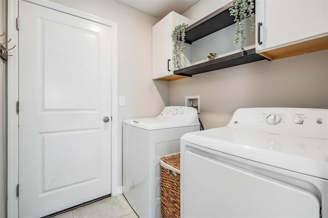 9839 Lemon Drop Loop, Sun City Center, FL 33573 - washroom featuring cabinet space, separate washer and dryer, and light tile patterned flooring
