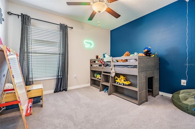 9839 Lemon Drop Loop, Sun City Center, FL 33573 - bedroom featuring carpet floors and a ceiling fan